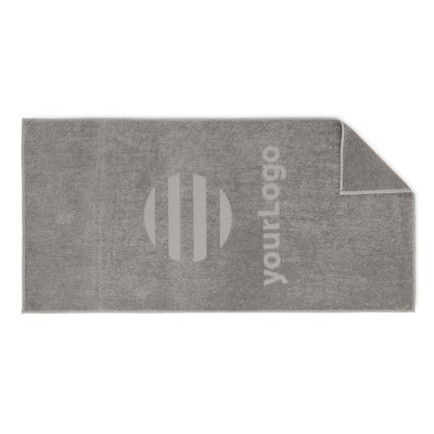 Domborszövött, 350 g/m² pamut strandtörölköző.